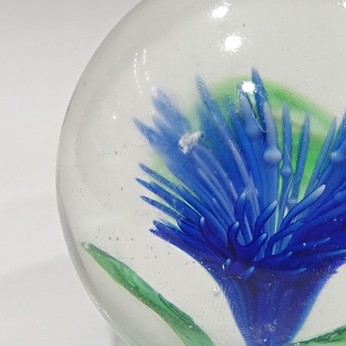 Vintage handmade art glass paperweight with blue flower