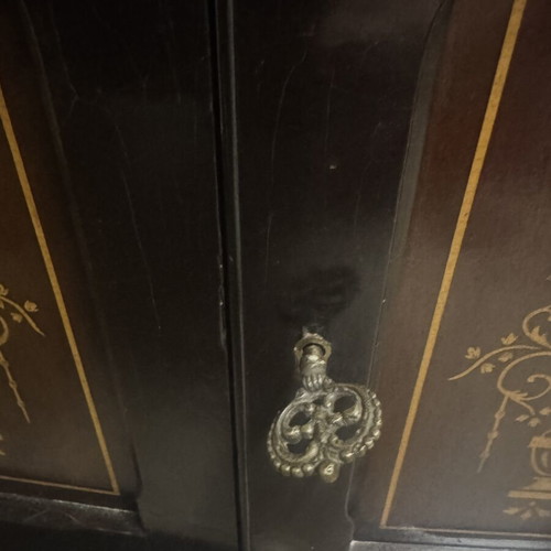 Vintage wooden cabinet used with decorative gold inlay