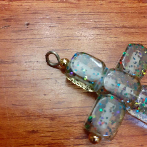Cross large with glitter used, synthetic material