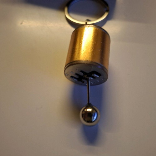 Gear shift lever keychain like new, orange and silver