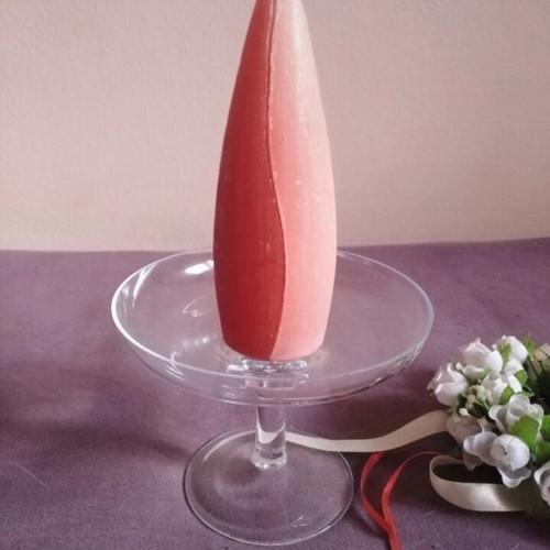 Glass candlestick with wreath and two-tone candle used