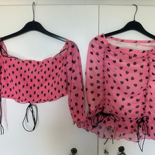 Top and skirt set pink with black hearts, like new, size small