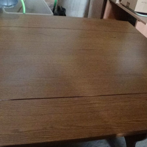 Wooden dining table used with extension