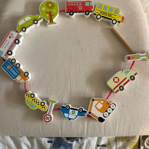 Fine motor skills toy used with cars on a string