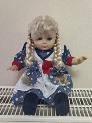 Vintage children's doll plastic with fabric like new