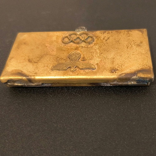 Vintage brass cigarette case from 1936 Olympics, used