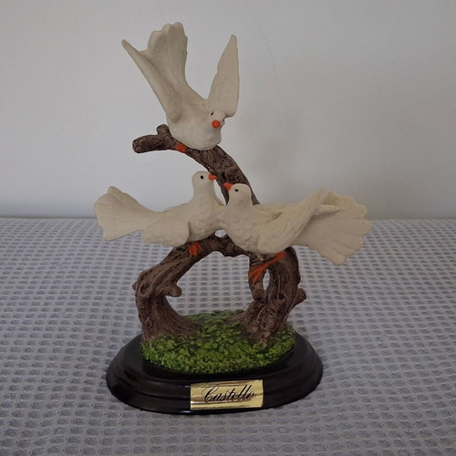 Castello decoration with three white doves on wooden base used