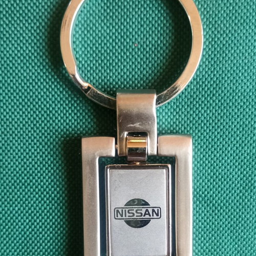 Vintage Nissan spinning keychain, New Old Stock, heavy metal 38g