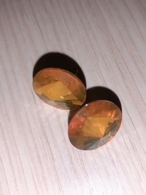 Earrings new with iridescent yellow stone