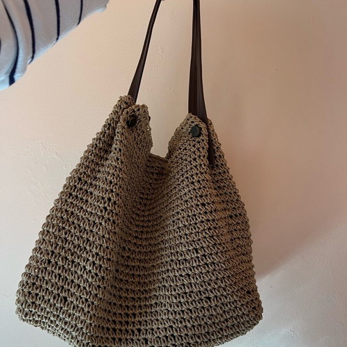 Woven boho style beach bag like new with brown leather handles and inner zip pocket