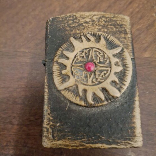 Custom Zippo lighter with handcrafted wooden tribal sun design