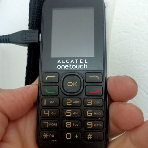 Alcatel OneTouch classic mobile phone used with keypad