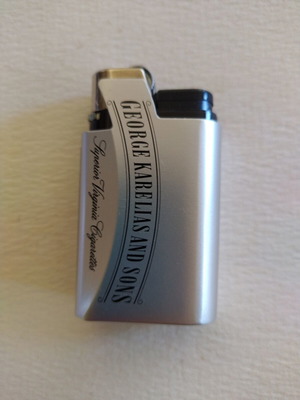George Karelias and Sons metal promotional case with lighter new