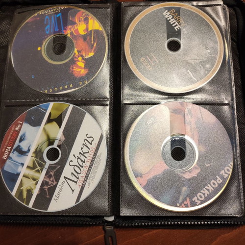 Set of 48 used music CDs with free case