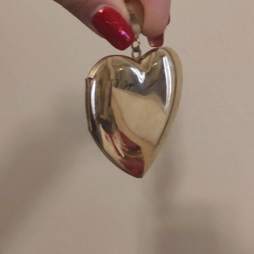 Large heart pendant like new, gold color with photo holder