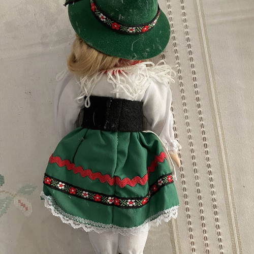 Porcelain doll with traditional costume green and red like new