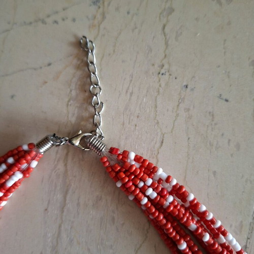 Necklace like new with 10 strands of small coral and white beads