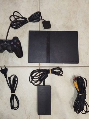 PlayStation 2 console used with cables and one controller