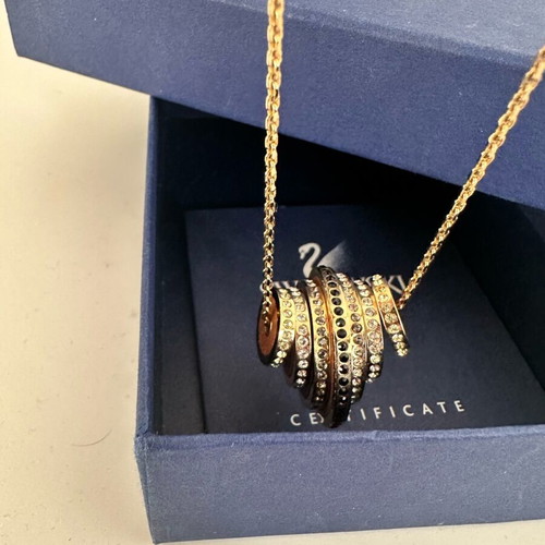 Swarovski Further necklace like new, gold tone with black and clear crystals