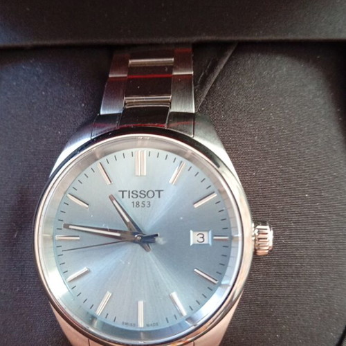 Tissot watch new with light blue dial and steel bracelet