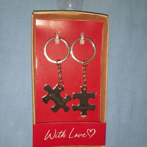 Puzzle piece keychain set with "Better Together" message, silver