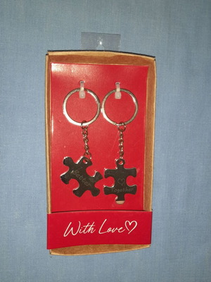 Puzzle piece keychain set with "Better Together" message, silver