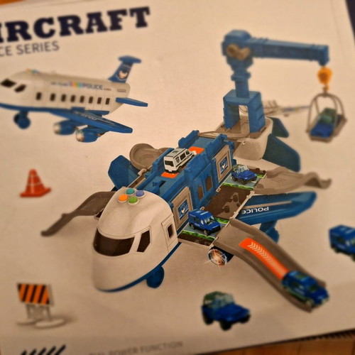 Airplane toy used with lights and sounds, transforms into station