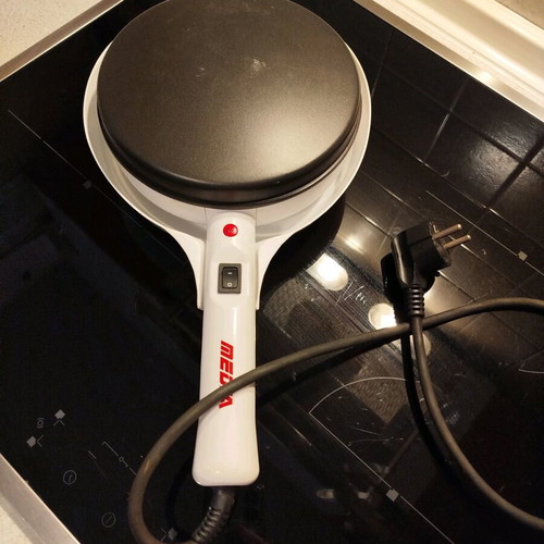 Electric handheld crepe maker like new with non-stick surface
