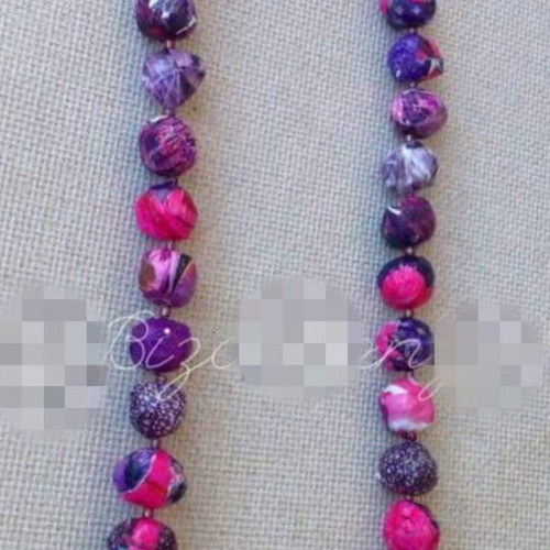 Long handmade bow tie necklace in purple and pink