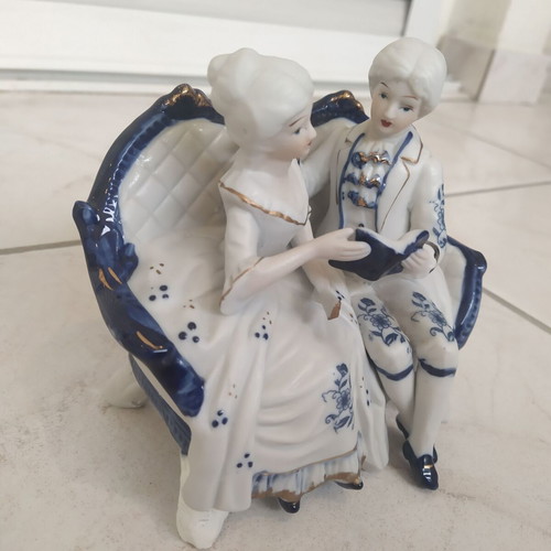 Vintage couple figurine reading on sofa rococo style like new
