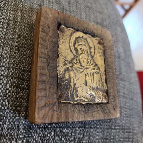 Saint Anthony brass icon on wood