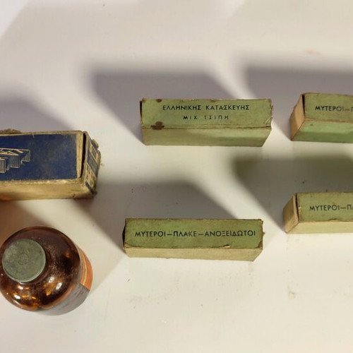 Antique staplers and two used bottles for decoration