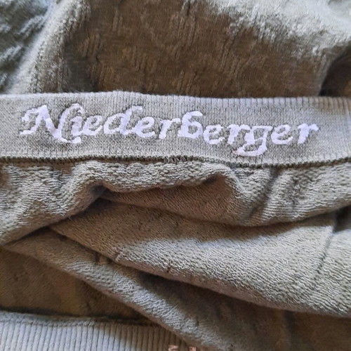 Niederberger Midi skirt new, khaki with embossed texture and knitted motif