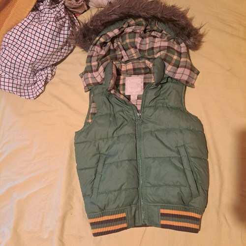 Green vest with hood and fur like new