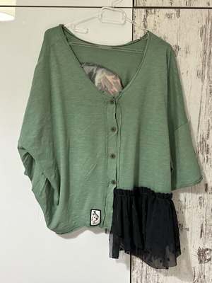 Asymmetric blouse made to order with Donatella details in black and green