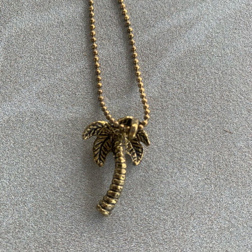 Gold-tone palm tree necklace like new