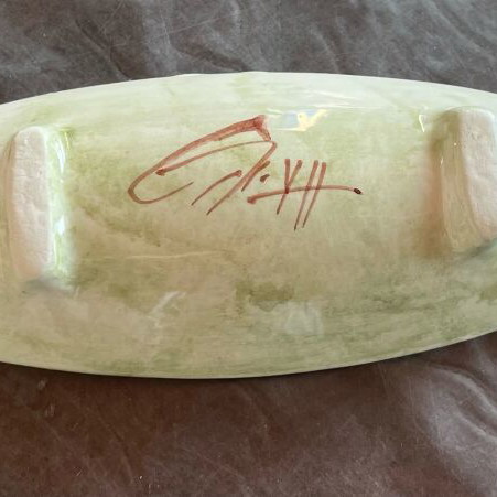 Ceramic small serving plate new, leaf-shaped with painted olives