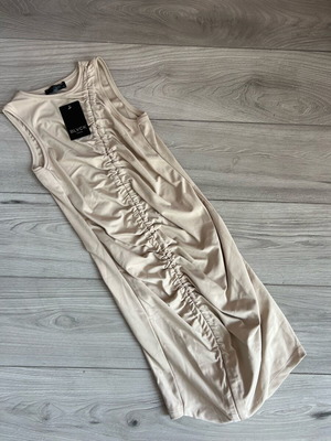 Beige dress new, unworn size M