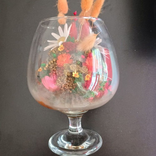 Decorative glass with dried flowers used