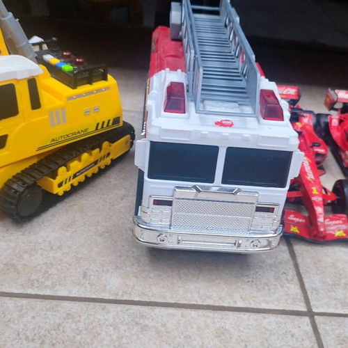 Toy cars used with working fire truck and bulldozer