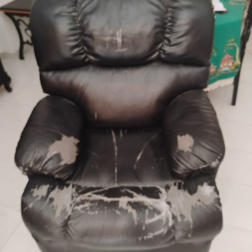 Relax massage armchair with visible wear