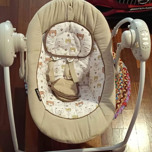 Electric baby bouncer used with music