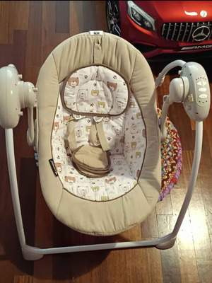 Electric baby bouncer used with music
