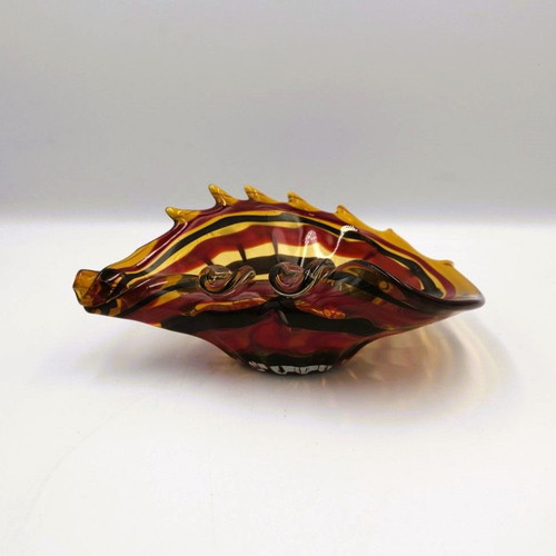 Glass ashtray used red with shell design