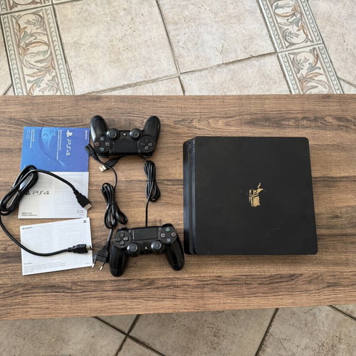 PlayStation 4 Slim 500GB used with 2 DualShock 4 controllers and accessories