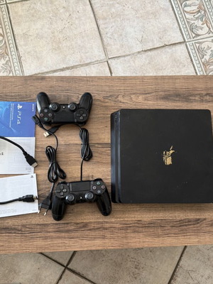 PlayStation 4 Slim 500GB used with 2 DualShock 4 controllers and accessories