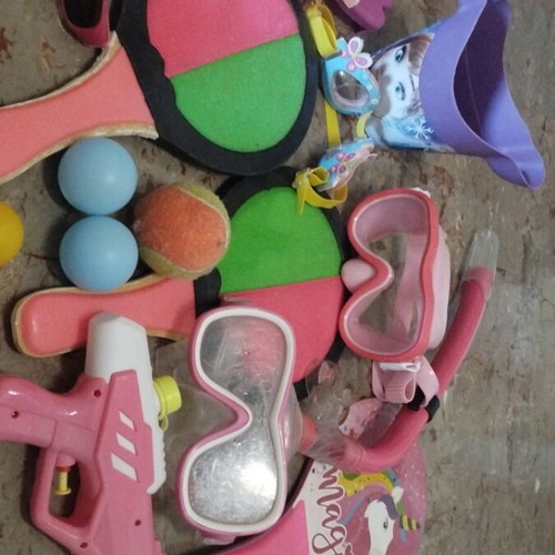 Beach items used, pack with masks, rackets, balls, bucket, sunglasses
