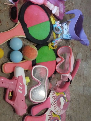 Beach items used, pack with masks, rackets, balls, bucket, sunglasses