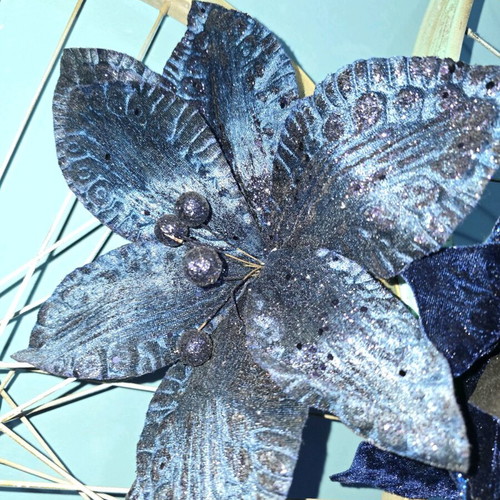 Christmas flowers used, dark blue decorations