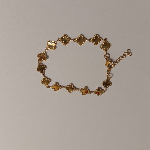 Gold bracelet with four-leaf clover design, brand new